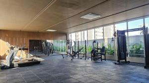 a gym with chairs and exercise equipment in a building at Apartamento Fantástico COP30 - 1o Aluguel - Novo! in Belém