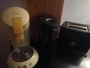 a room with a hair dryer next to a hair dryer at Studio au pied des pistes in Bagnères-de-Bigorre