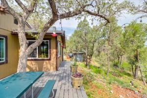 a porch of a house with a tree at Mtn-View Gem on 20 Acres Patagonia Cabin Hideaway in Patagonia