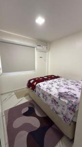 Ένα ή περισσότερα κρεβάτια σε δωμάτιο στο Apartamento 3 quartos HANGAR COP 30 e CÍRIO