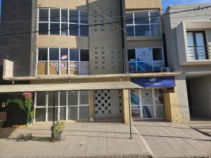 a building with a sign on the front of it at dto kumelen in Plottier