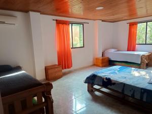 Postel nebo postele na pokoji v ubytování La Trinidad