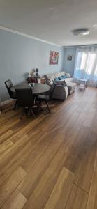a living room with a couch and a table at Appartement à Disney in Bailly-Romainvilliers