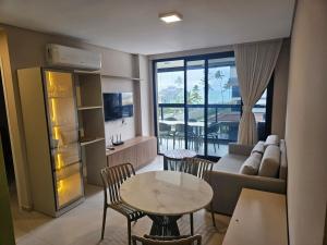 TV a/nebo společenská místnost v ubytování Viva Muro Alto no Cais 208