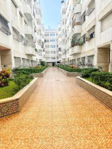 a walkway in a large apartment building at La gironde family apartment in Casablanca