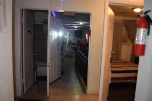 a hallway leading into a room with a mirror at Miami Drip Star Life Hostel in Parkway Regional Medical Center Heliport