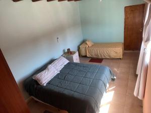 a bedroom with two beds in a room at La Amarilla in Santa María