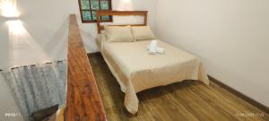 Giường trong phòng chung tại Loft da Bia