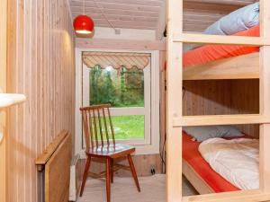 Ένα ή περισσότερα κρεβάτια σε δωμάτιο στο 6 person holiday home in Ebeltoft-By Traum