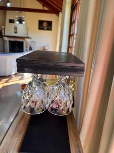 a table with glass dishes on top of a table at Estalagem Fernandes in Monte Verde +79 photos
