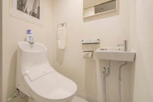 a white bathroom with a toilet and a sink at LANG - Vacation STAY 22203v in Tokyo +15 photos