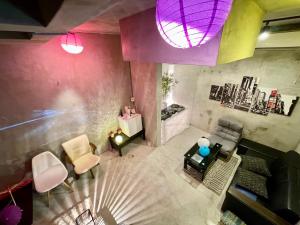 an overhead view of a living room with purple walls at Ichinagi Private Family Villa Near Nippori with Easy Access to Narita and Asakusa in Tokyo