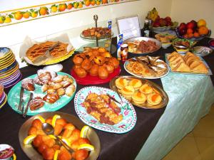 a table topped with lots of different types of food at Locanda Degli Agrumi in Conca dei Marini