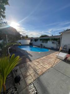 a swimming pool in the backyard of a house at Miami Drip Star Life Resort in Parkway Regional Medical Center Heliport