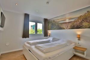 En eller flere senge i et værelse på Blanker Hans 03 - Ferienwohnung