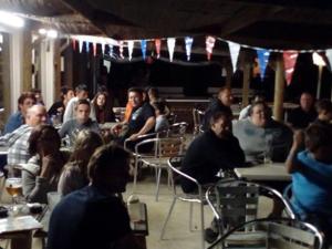 a group of people sitting at tables in a room at Mobil home 8 pers avec terrasse à Saint-Sornin - API-1-52-461 in Saint-Sornin