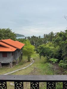 a view from a balcony of a house at Room with a view Chaloklum in Koh Phangan
