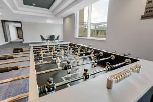 a room with a group of figurines in the middle at 1 br 2bed LakeView Rooftop Pool in Boynton Beach +41 photos