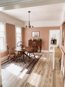 a dining room with a table and chairs at Garden Oasis 3BR 15 min FIFA World Cup MetLife Std in Harrison