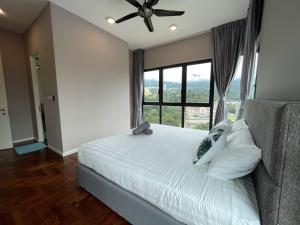 Ένα ή περισσότερα κρεβάτια σε δωμάτιο στο Cozy 2 Bedroom Suite Vista Genting FREE WIFI +16 φωτογραφίες