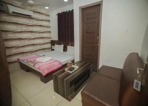Ένα ή περισσότερα κρεβάτια σε δωμάτιο στο HOTEL LIME WOOD