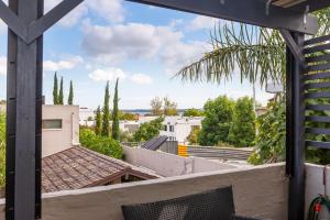 a view from the balcony of a house at Como Mezzanine Retreat in Perth
