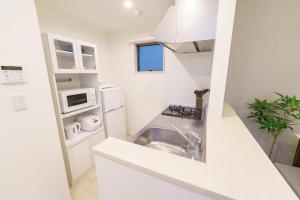 Η κουζίνα ή μικρή κουζίνα στο 6 min to Nagoya Brand-new building Sleeps 5 +19 φωτογραφίες