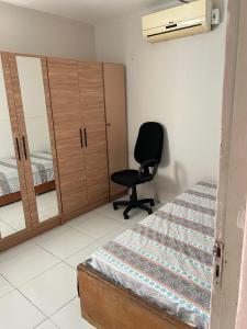 Ένα ή περισσότερα κρεβάτια σε δωμάτιο στο Apartamento aconchegante perto da rodoviária