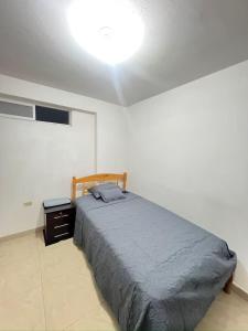 Ένα ή περισσότερα κρεβάτια σε δωμάτιο στο Departamento, Hospedaje, Shopping, UniversidadSG