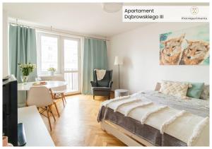 a bedroom with a bed and a desk and a table at PiotrApartments - Big City Life Apartments in Central Warszawa in Warsaw