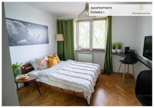 a bedroom with a bed with green curtains and a desk at PiotrApartments - Big City Life Apartments in Central Warszawa in Warsaw +73 photos