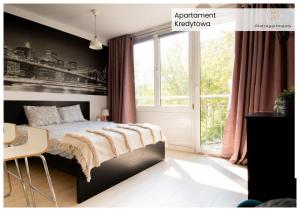 a bedroom with a bed and a window at PiotrApartments - Big City Life Apartments in Central Warszawa in Warsaw