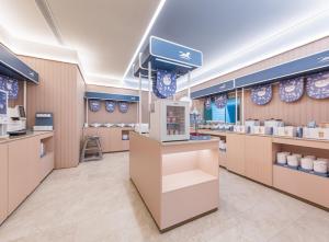 a store interior with counters and a food court at Hanting Hotel Beijing Fangzhuang Fangxingyuan in Beijing +6 photos