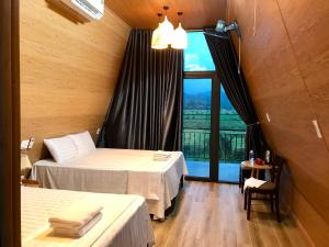 Ένα ή περισσότερα κρεβάτια σε δωμάτιο στο Happy field homestay Phong Nha