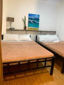 Ένα ή περισσότερα κρεβάτια σε δωμάτιο στο Hakuna Matata Lodge