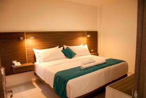 Llit o llits en una habitació de Hotel MS