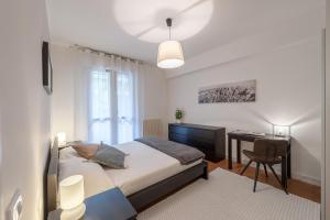 Ένα ή περισσότερα κρεβάτια σε δωμάτιο στο Il Parco Apartments