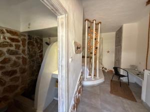 a room with a stone wall and a table at Atlazia Suites in Alinda +124 photos