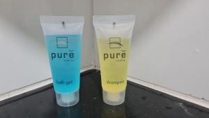 a couple of bottles of sunscreen sitting on a shelf at Laman D'Village in Kelebang Besar