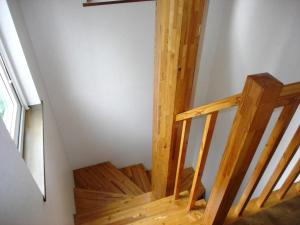 a wooden staircase in a room with a window at Cottage All Resort Service / Vacation STAY 8427 in Inawashiro