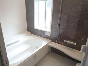 a bathroom with a tub and a shower with a window at Cottage All Resort Service / Vacation STAY 8399 in Inawashiro