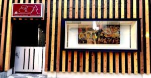 a picture in a window on a striped building at 3-25-2 Higashiogu - Apartment / Vacation STAY 8348 in Tokyo
