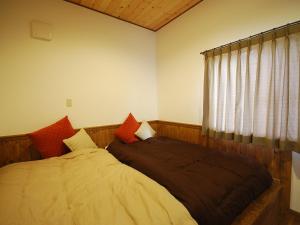 a bedroom with a bed and a window at Cottage All Resort Service / Vacation STAY 8445 in Inawashiro