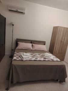 Ένα ή περισσότερα κρεβάτια σε δωμάτιο στο La casa di Anna e Lillo