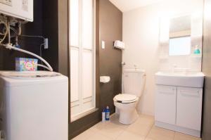 a small bathroom with a toilet and a sink at Sannand / Vacation STAY 2188 in Sapporo