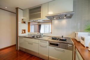 a kitchen with a sink and a stove at HOTEL SPICE - Vacation STAY 34504v in Ishigaki Island