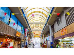 an aisle of a store with a ceiling with flags at HOTEL SPICE - Vacation STAY 34504v in Ishigaki Island