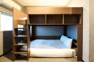 Ένα ή περισσότερα κρεβάτια σε δωμάτιο στο Sapporo - Apartment - Vacation STAY 29227v