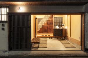 an entrance to a building with a door with a bench at Minato-ku - House / Vacation STAY 12127 in Tokyo