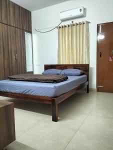 Ένα ή περισσότερα κρεβάτια σε δωμάτιο στο BG Greens Service Apartments